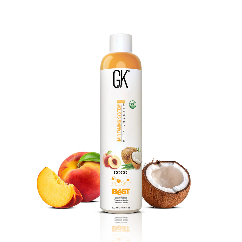 GK Hair The Best Coco Hair Treatment Pro 300 ml bottle, front view with sliced peach and halved coconut alongside