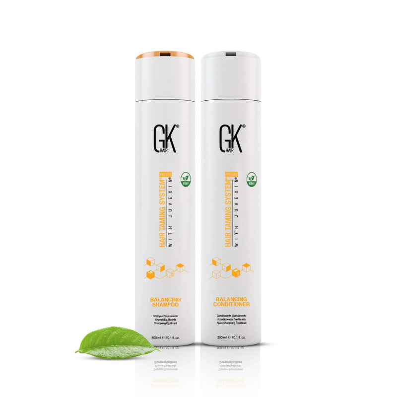 GK Hair Balancing Shampoo and Conditioner 300 ml bottles side by side with a green leaf on a white background