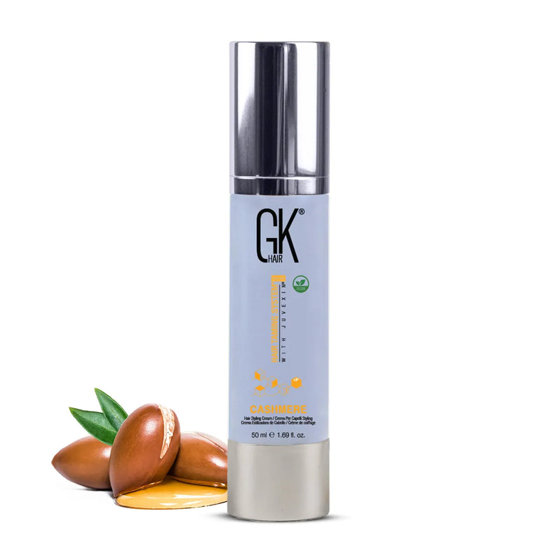 GK Hair Cashmere Hair Styling Cream 50 ml pale blue pump bottle beside argan nuts and oil