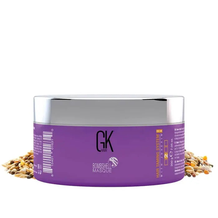 GK Hair Red Red Bombshell Hair Color Masque 200 g purple tub with a silver lid, surrounded by scattered seeds and grains
